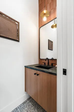 a view of a bathroom with a sink and mirror