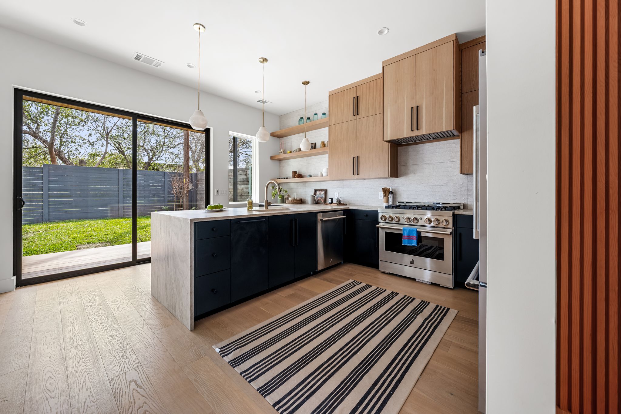 1703 Miami Drive Austin, TX 78733 - Photo 3 of 35 Sliders opening to backyard deck