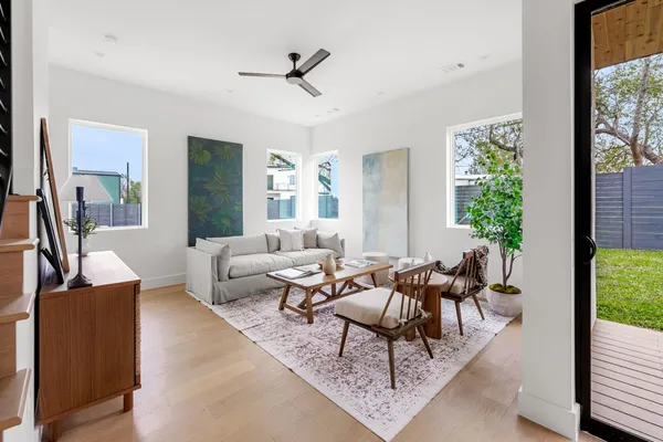 a living room with furniture and a large window