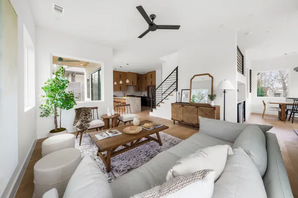 a living room with furniture or couch and a potted plant