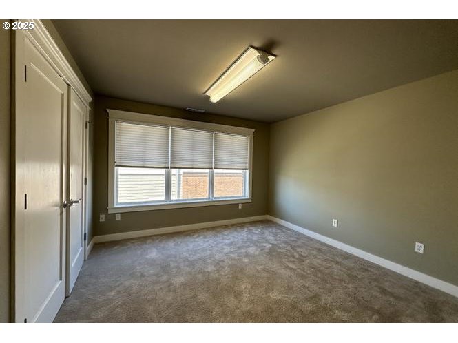 1505 Northeast Village Street Fairview, OR 97024 - Photo 15 of 33 a view of an empty room with a window