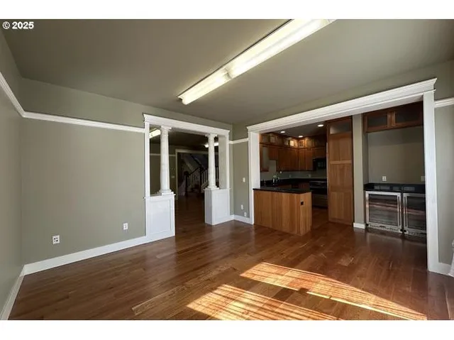 a view interior of a house wooden floor and kitchen