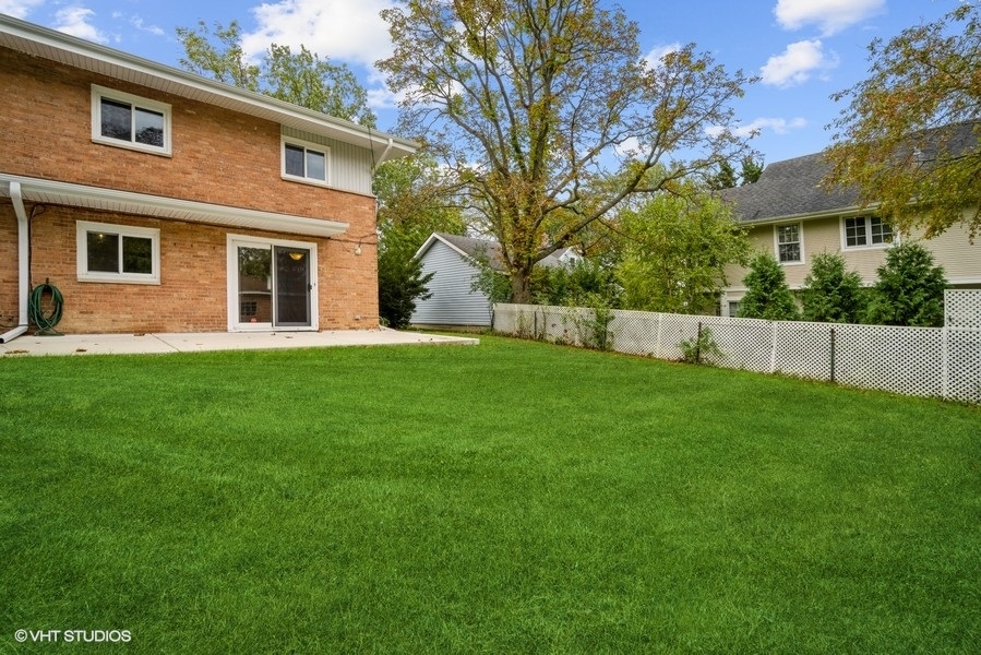 912 Chestnut Street Deerfield, IL 60015 - Photo 19 of 20 a front view of a house with a yard and trees