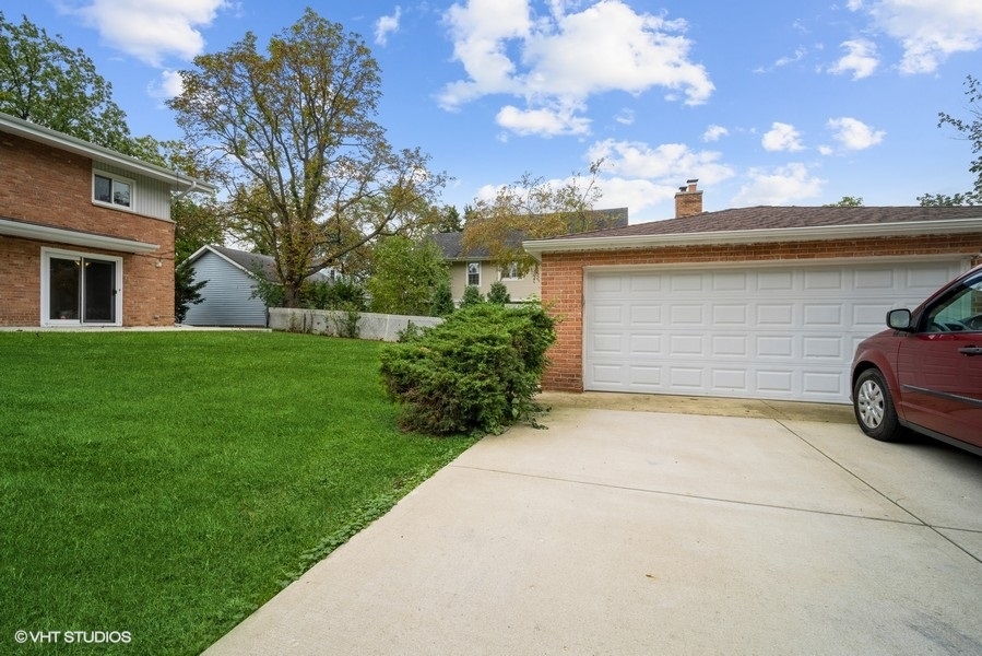 912 Chestnut Street Deerfield, IL 60015 - Photo 20 of 20 a view of a car parked in front of a house with a big yard