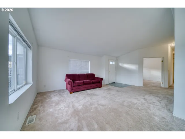 a view of a livingroom with furniture and a flat screen tv