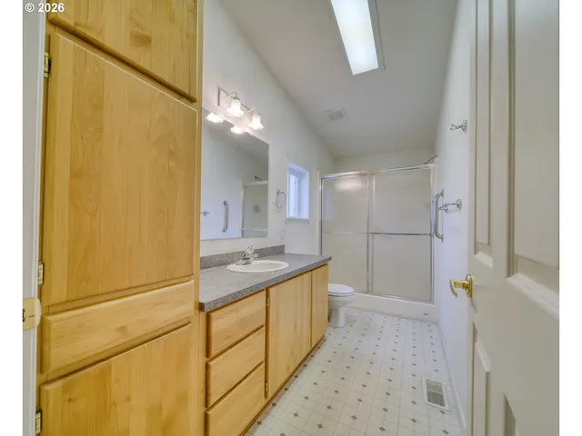a bathroom with a sink a vanity and a mirror