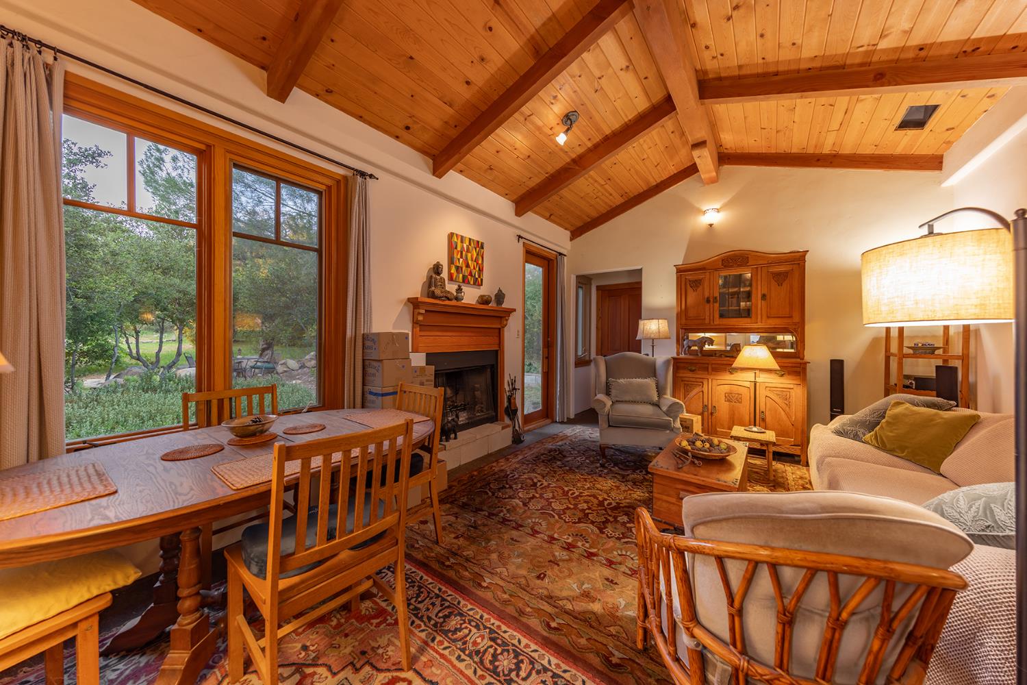 11954 Sulphur Mountain Road Ojai, CA 93023 - Photo 21 of 41 a living room with furniture a fireplace and next to a window