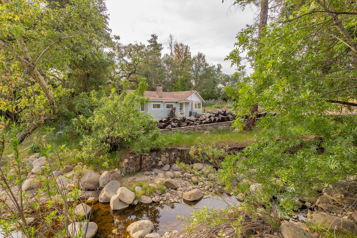 11954 Sulphur Mountain Road Ojai, CA 93023 - Photo 28 of 41 a backyard of a house with lots of green space