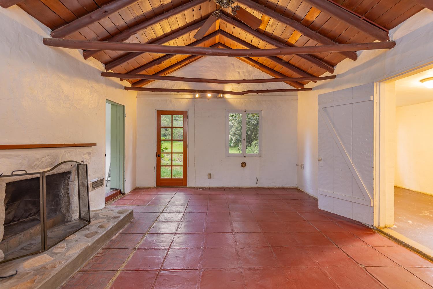 11954 Sulphur Mountain Road Ojai, CA 93023 - Photo 31 of 41 a view of a livingroom with an empty space and a fireplace
