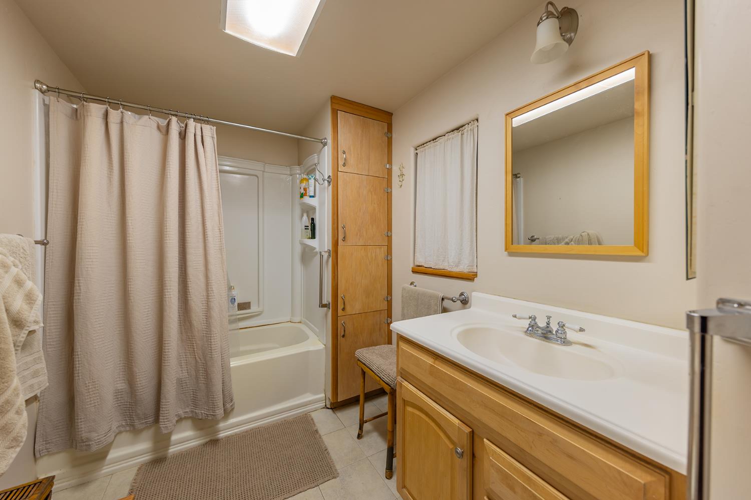 11954 Sulphur Mountain Road Ojai, CA 93023 - Photo 37 of 41 a bathroom with a sink a mirror and a shower