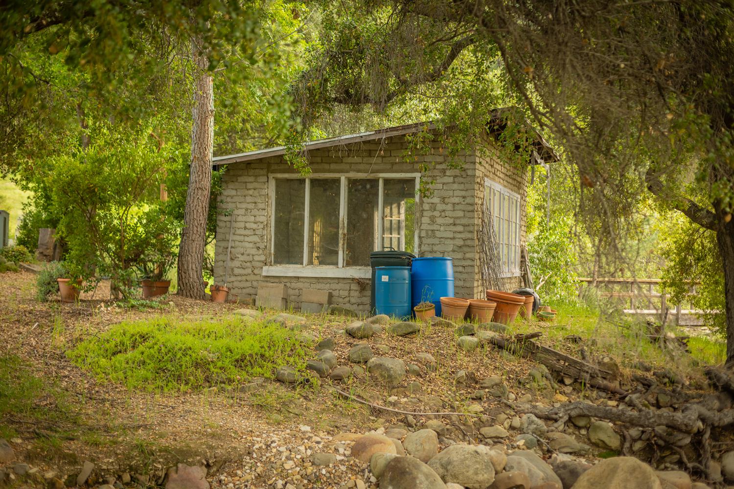 11954 Sulphur Mountain Road Ojai, CA 93023 - Photo 38 of 41 a front view of a house with a yard