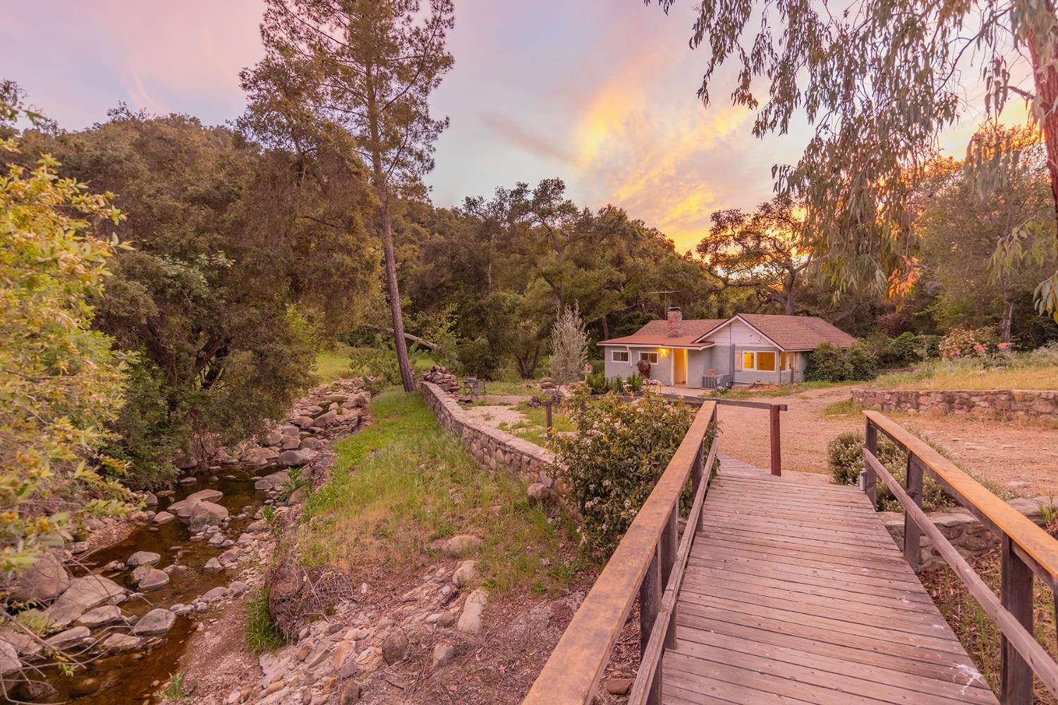 11954 Sulphur Mountain Road Ojai, CA 93023 - Photo 4 of 41 a view of a house with large trees