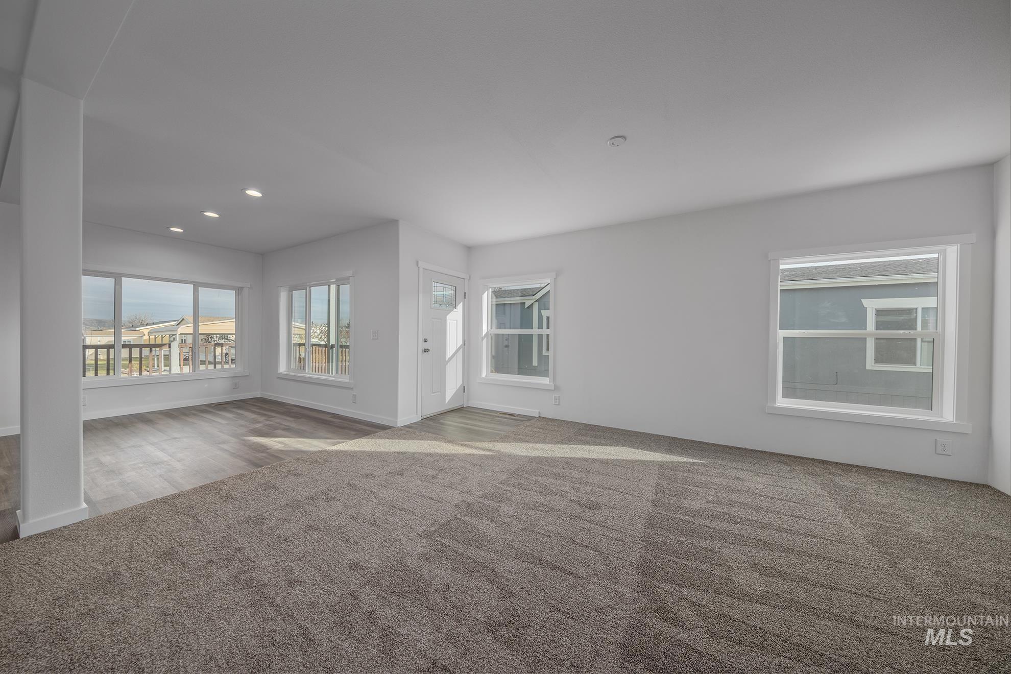 2750 Alden Road, Unit 8 Fruitland, ID 83619 - Photo 11 of 31 Spare room featuring carpet flooring and recessed lighting