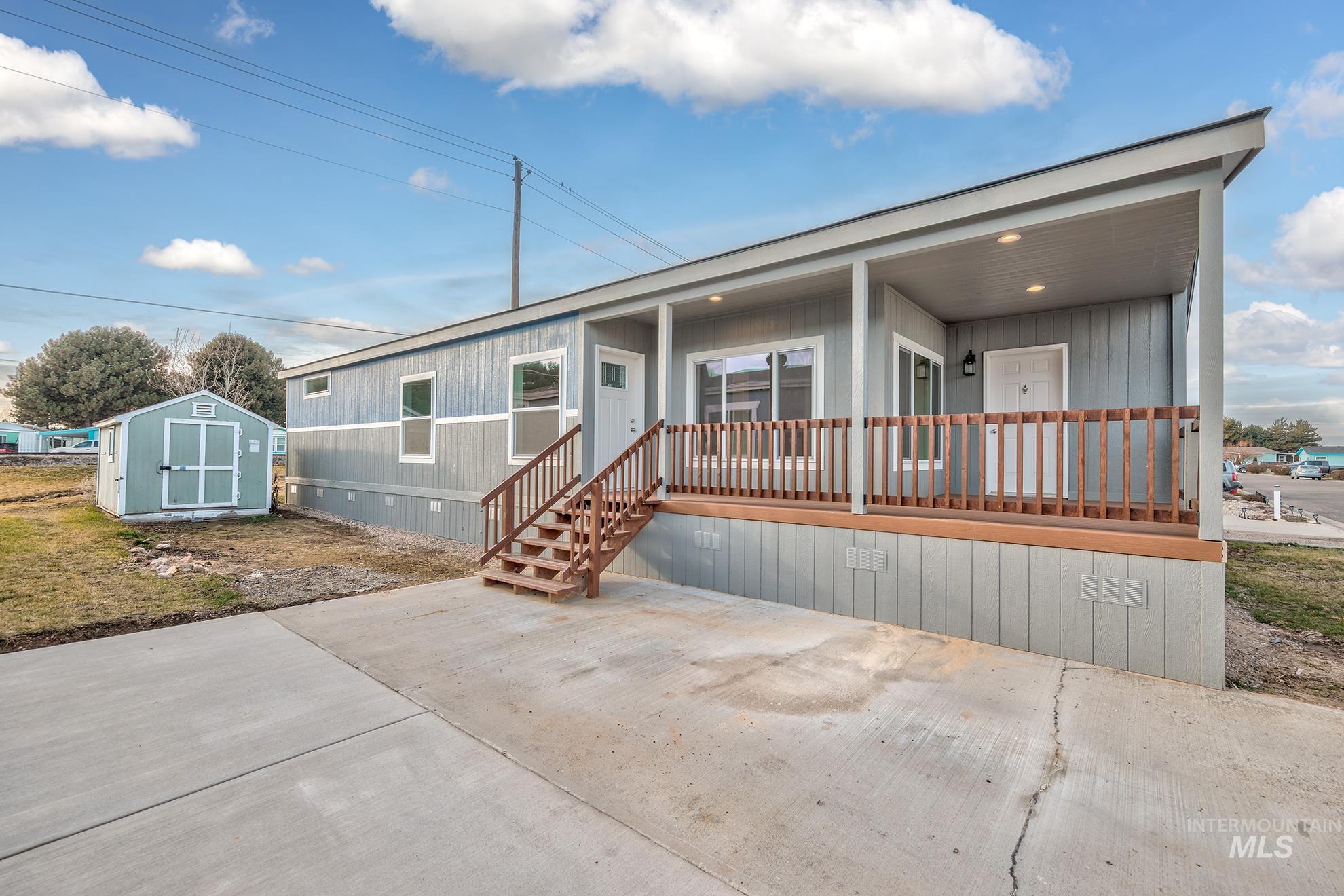 2750 Alden Road, Unit 8 Fruitland, ID 83619 - Photo 30 of 31 Manufactured / mobile home featuring a shed, crawl space, a patio area, and covered porch
