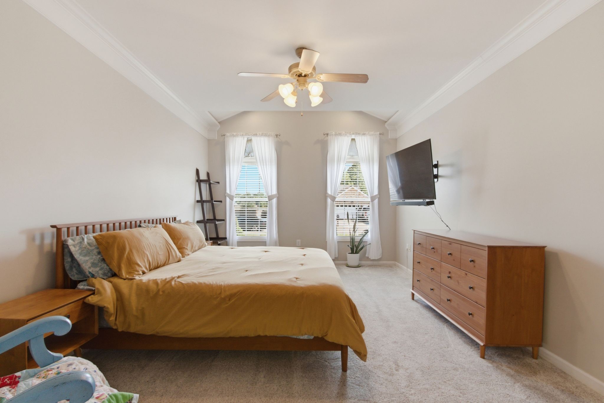 1503 Chapman Lane Spring Hill, TN 37174 - Photo 16 of 33 a spacious bedroom with a bed and a flat tv screen on dresser