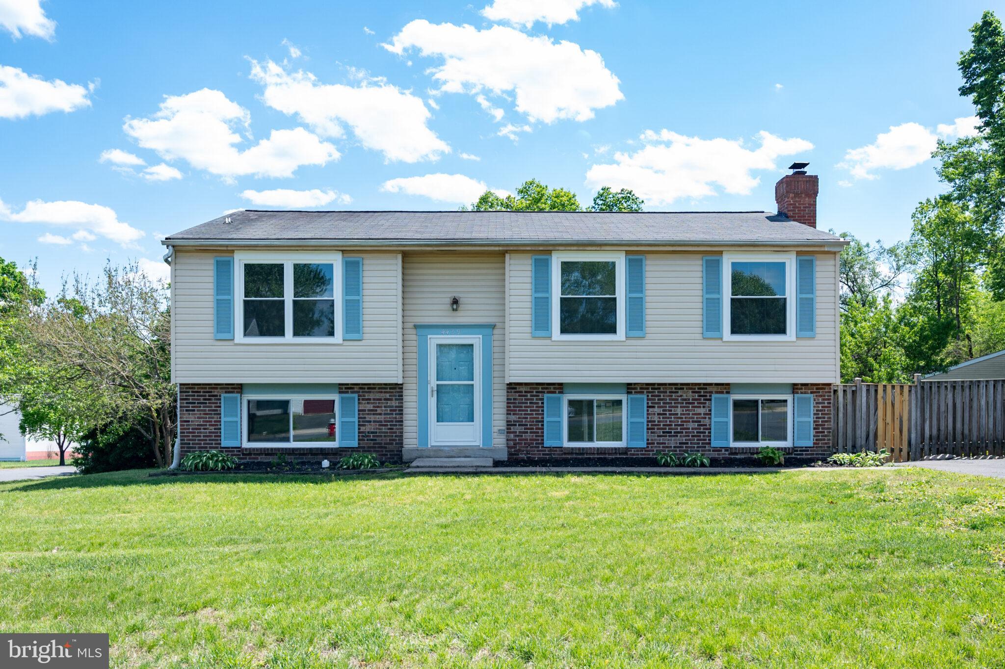 a view of a brick building next to a yard