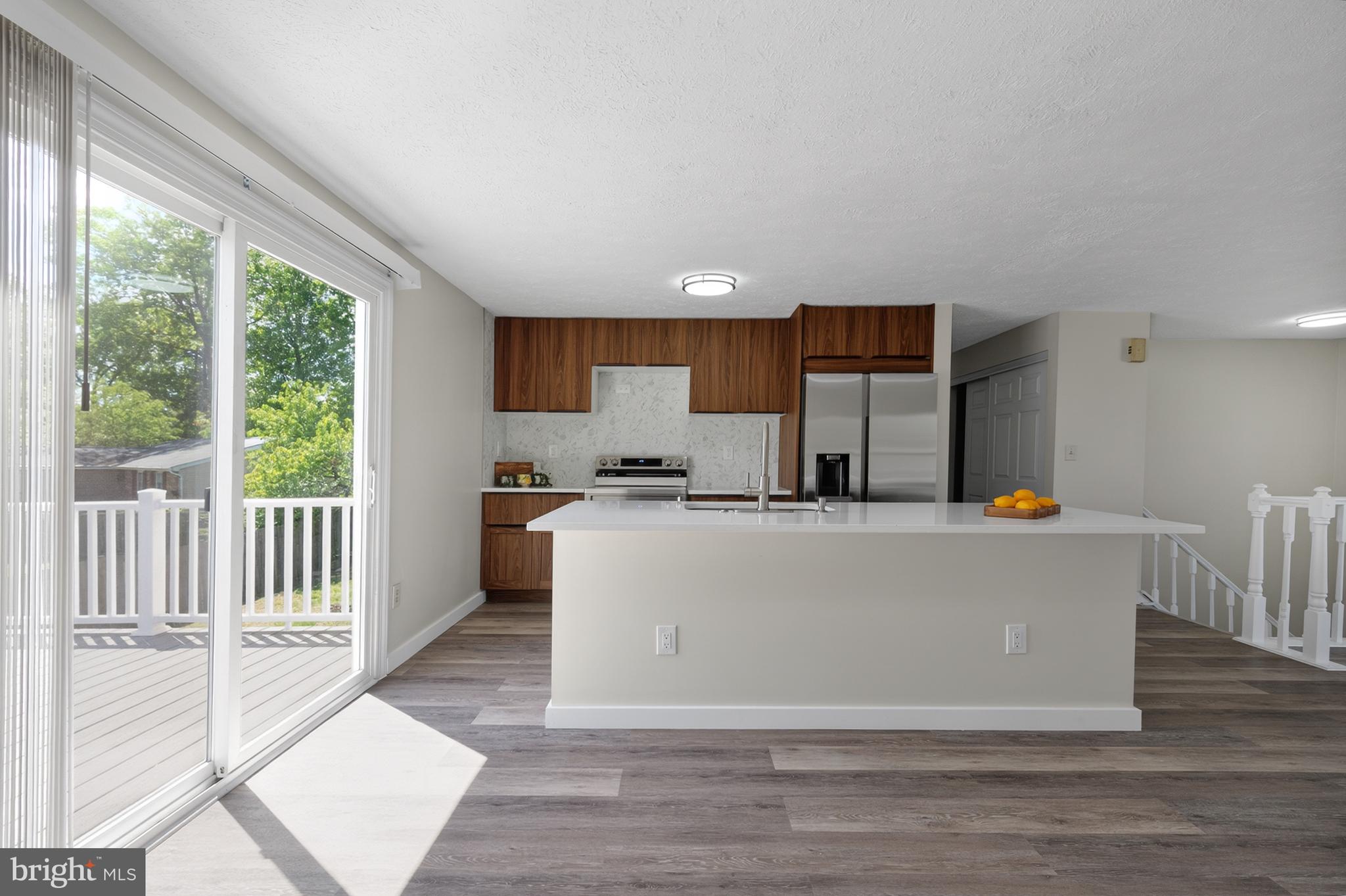 4429 Cub Run Road Chantilly, VA 20151 - Photo 14 of 56 a living room with wooden floor and a large window