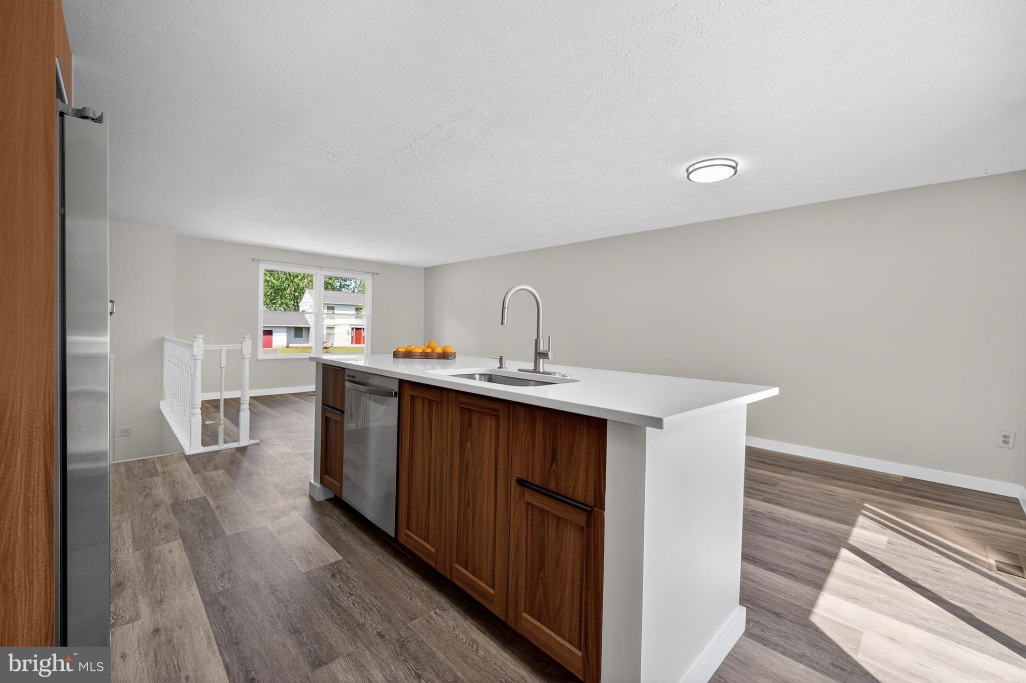 4429 Cub Run Road Chantilly, VA 20151 - Photo 15 of 56 a kitchen with a sink cabinets and wooden floor