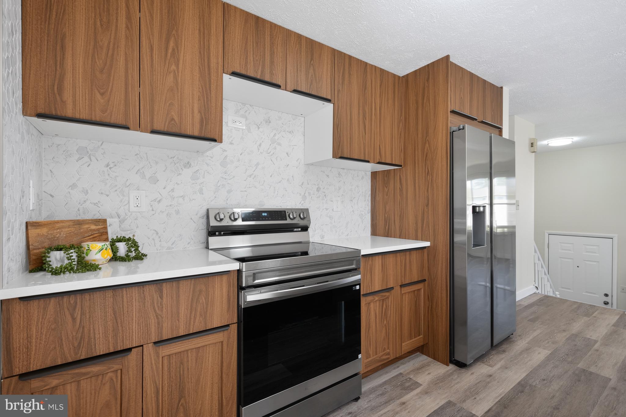 4429 Cub Run Road Chantilly, VA 20151 - Photo 17 of 56 a kitchen with a stove and a refrigerator