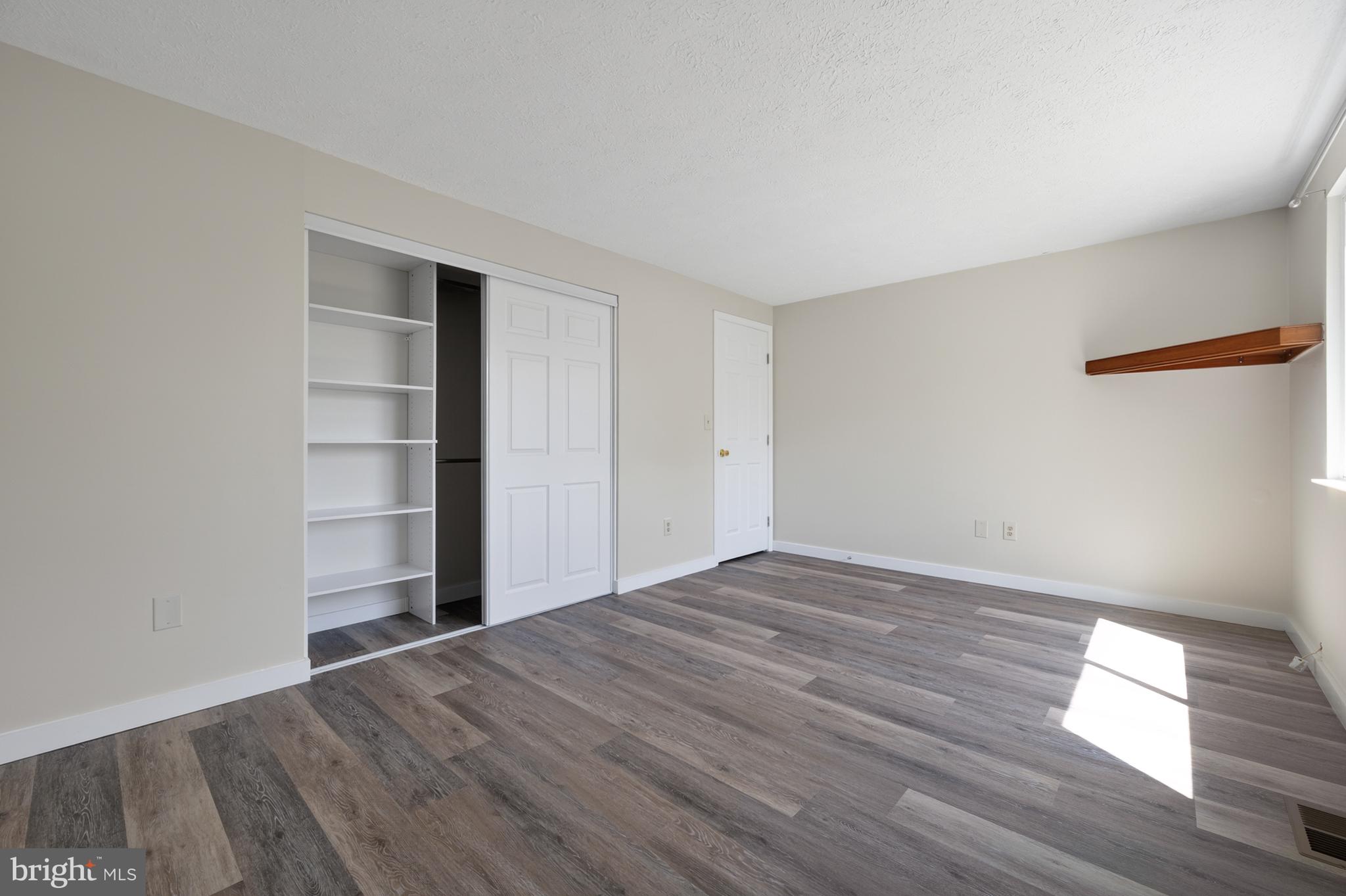 4429 Cub Run Road Chantilly, VA 20151 - Photo 19 of 56 a view of empty room with wooden floor and window
