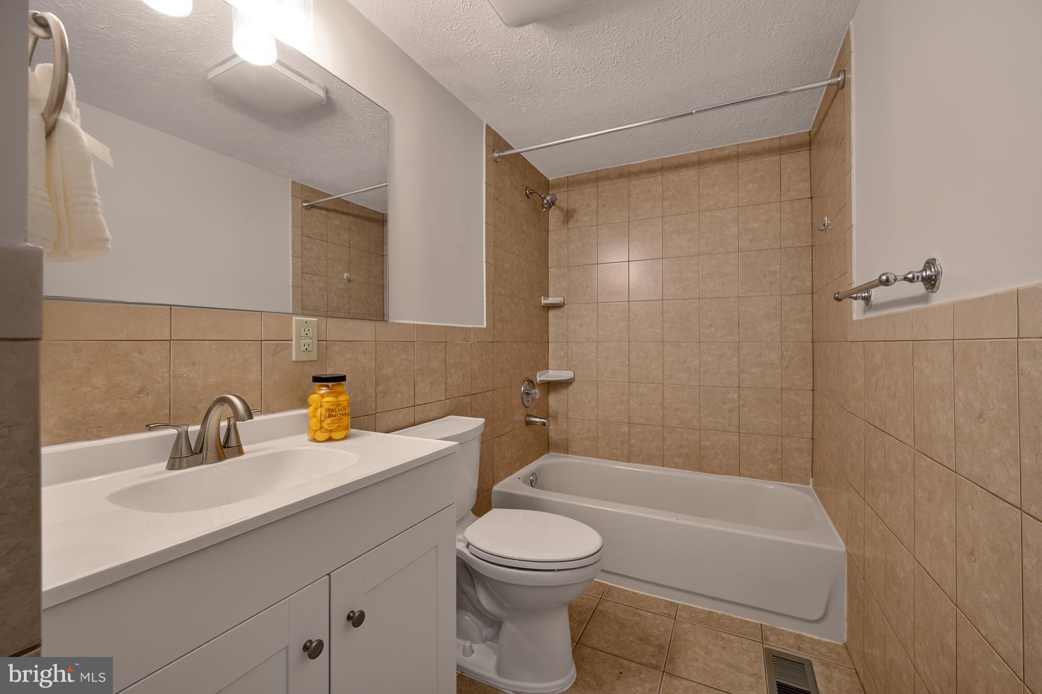 4429 Cub Run Road Chantilly, VA 20151 - Photo 24 of 56 a bathroom with a sink a toilet and shower