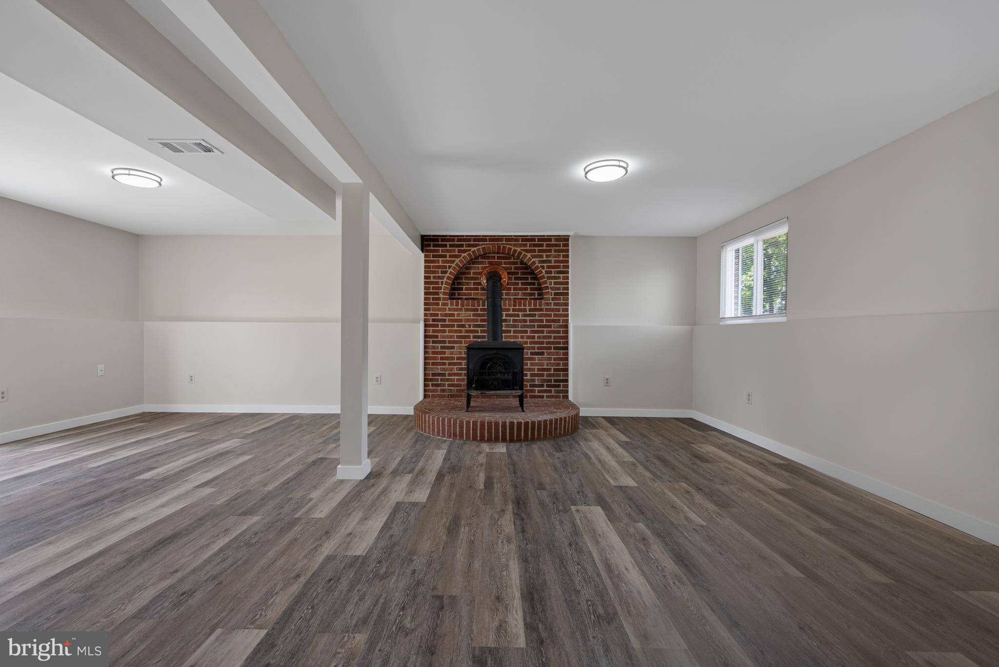 4429 Cub Run Road Chantilly, VA 20151 - Photo 25 of 56 wooden floor in an empty room with a window