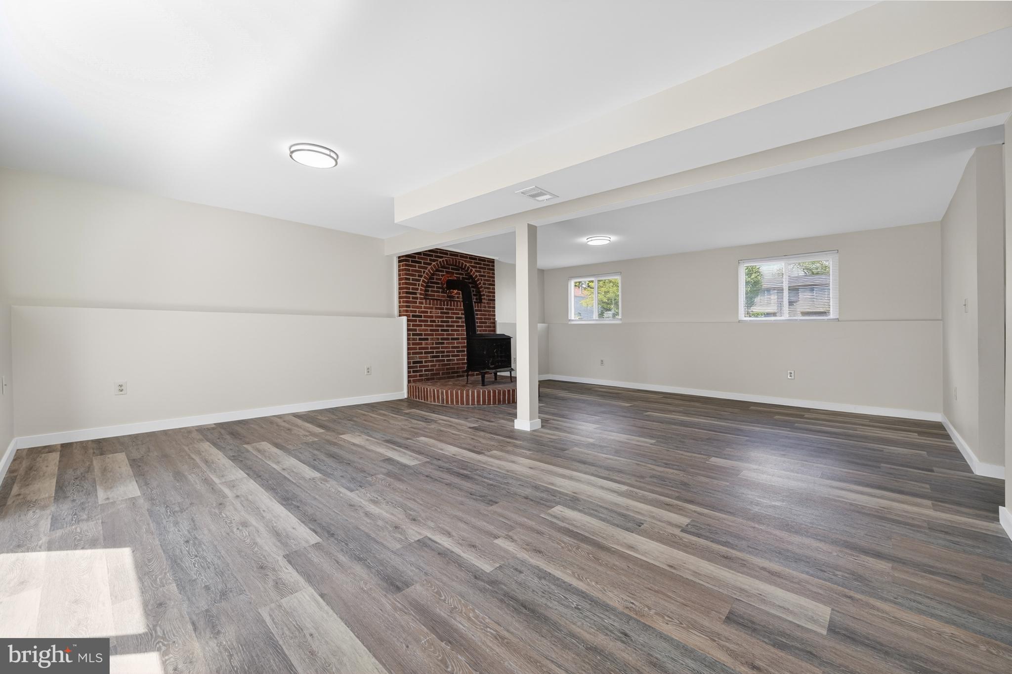 4429 Cub Run Road Chantilly, VA 20151 - Photo 27 of 56 an empty room with wooden floor and windows