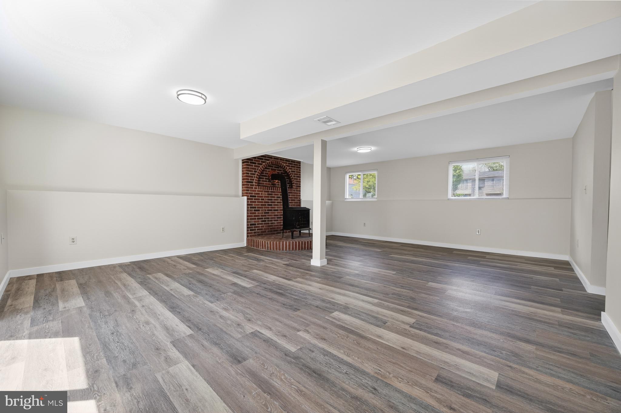 4429 Cub Run Road Chantilly, VA 20151 - Photo 28 of 56 an empty room with wooden floor and windows