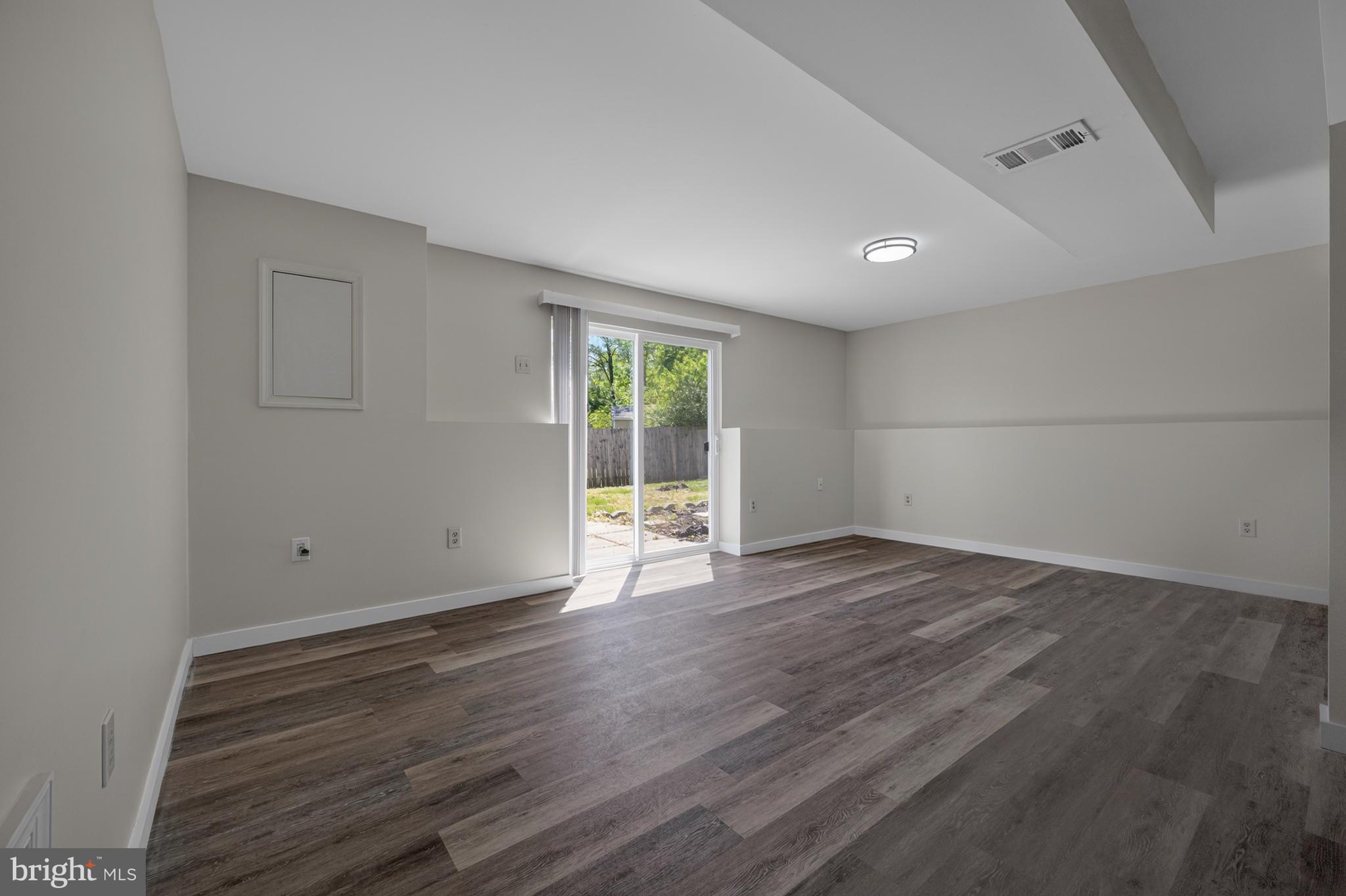 4429 Cub Run Road Chantilly, VA 20151 - Photo 29 of 56 an empty room with wooden floor and windows