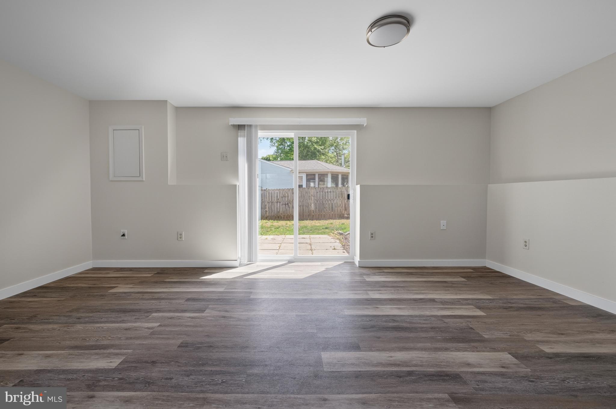 4429 Cub Run Road Chantilly, VA 20151 - Photo 31 of 56 a view of an empty room with wooden floor and a window