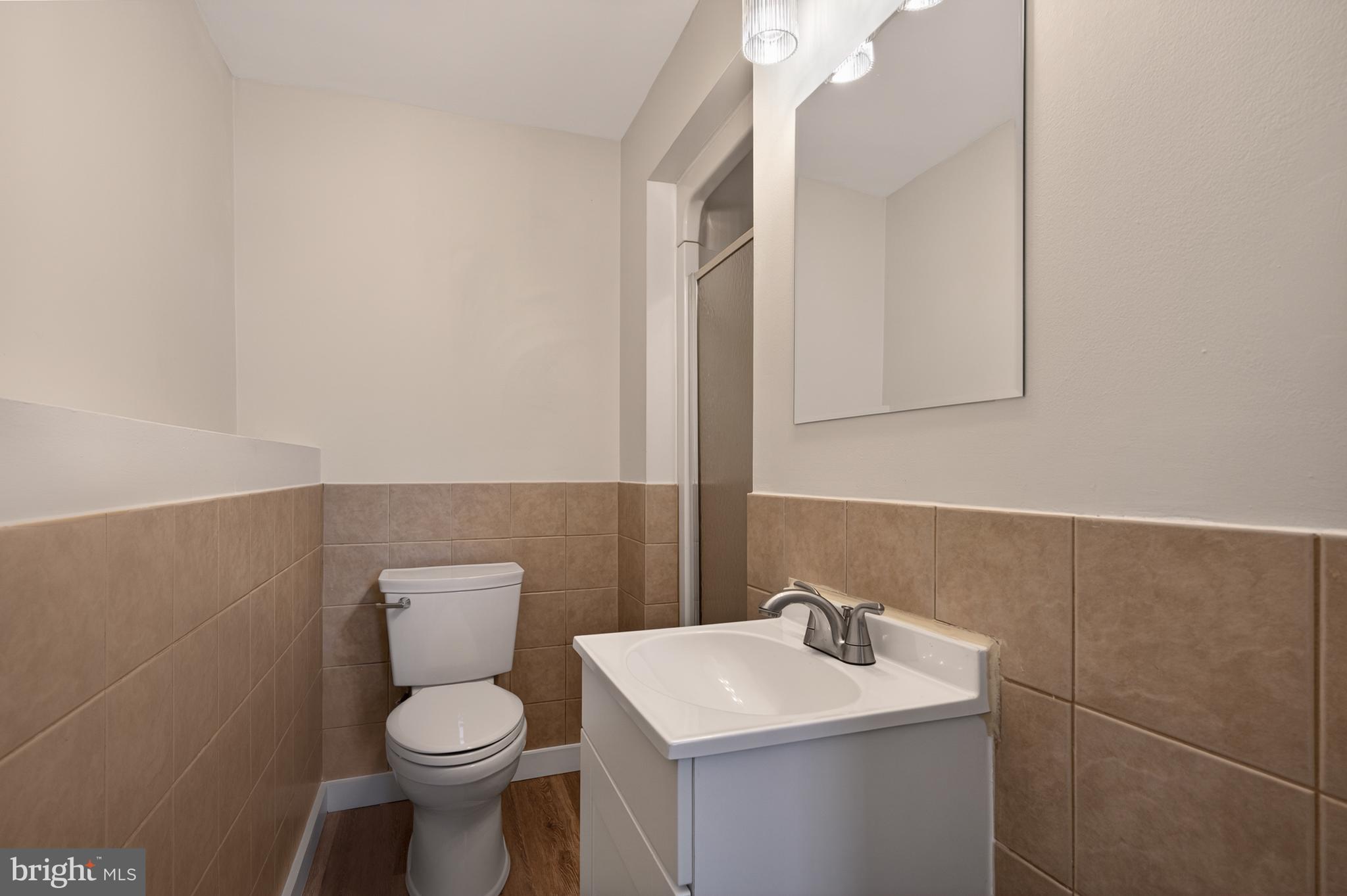 4429 Cub Run Road Chantilly, VA 20151 - Photo 32 of 56 a bathroom with a sink toilet and mirror