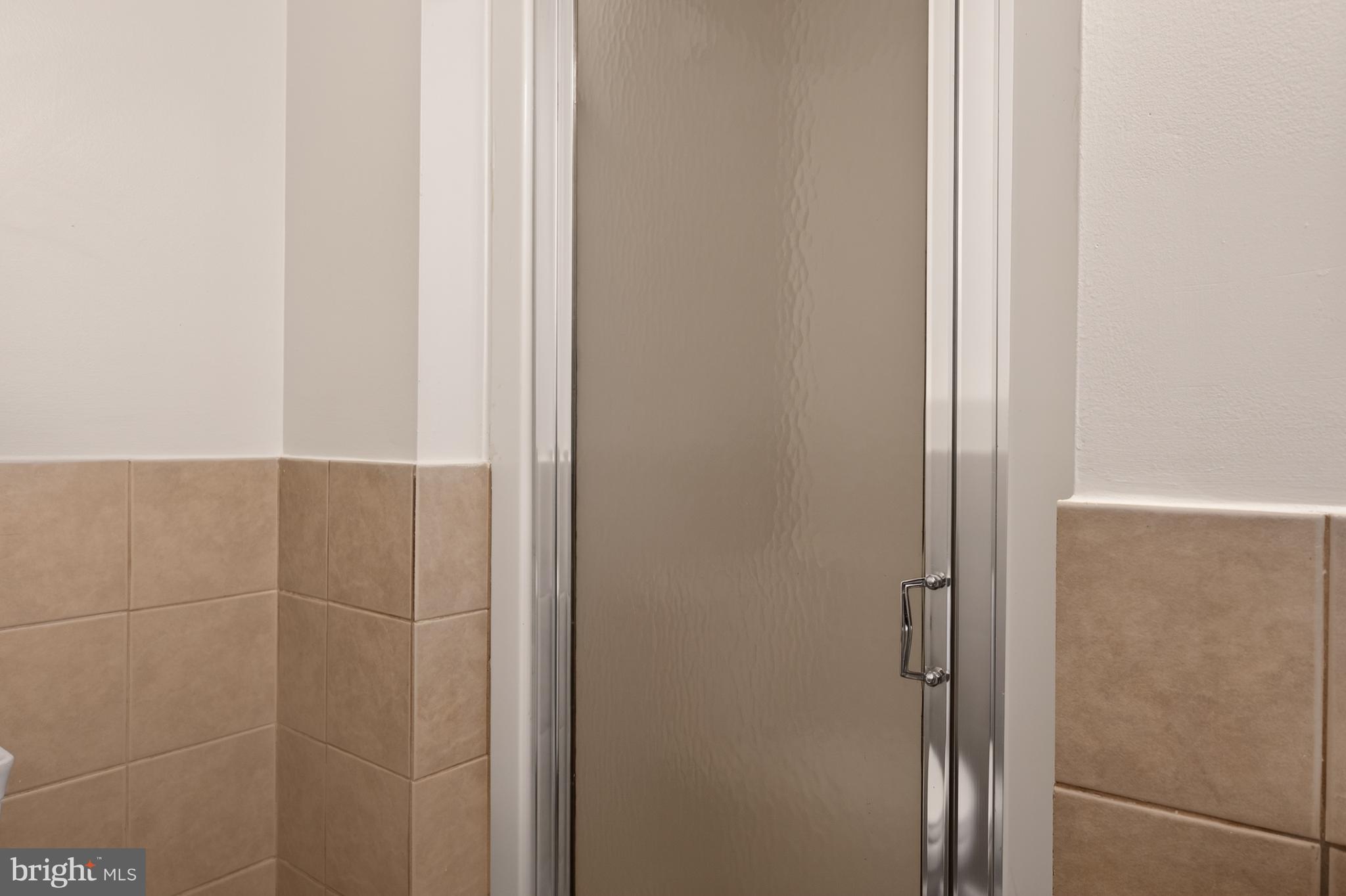 4429 Cub Run Road Chantilly, VA 20151 - Photo 33 of 56 a bathroom with a glass shower door