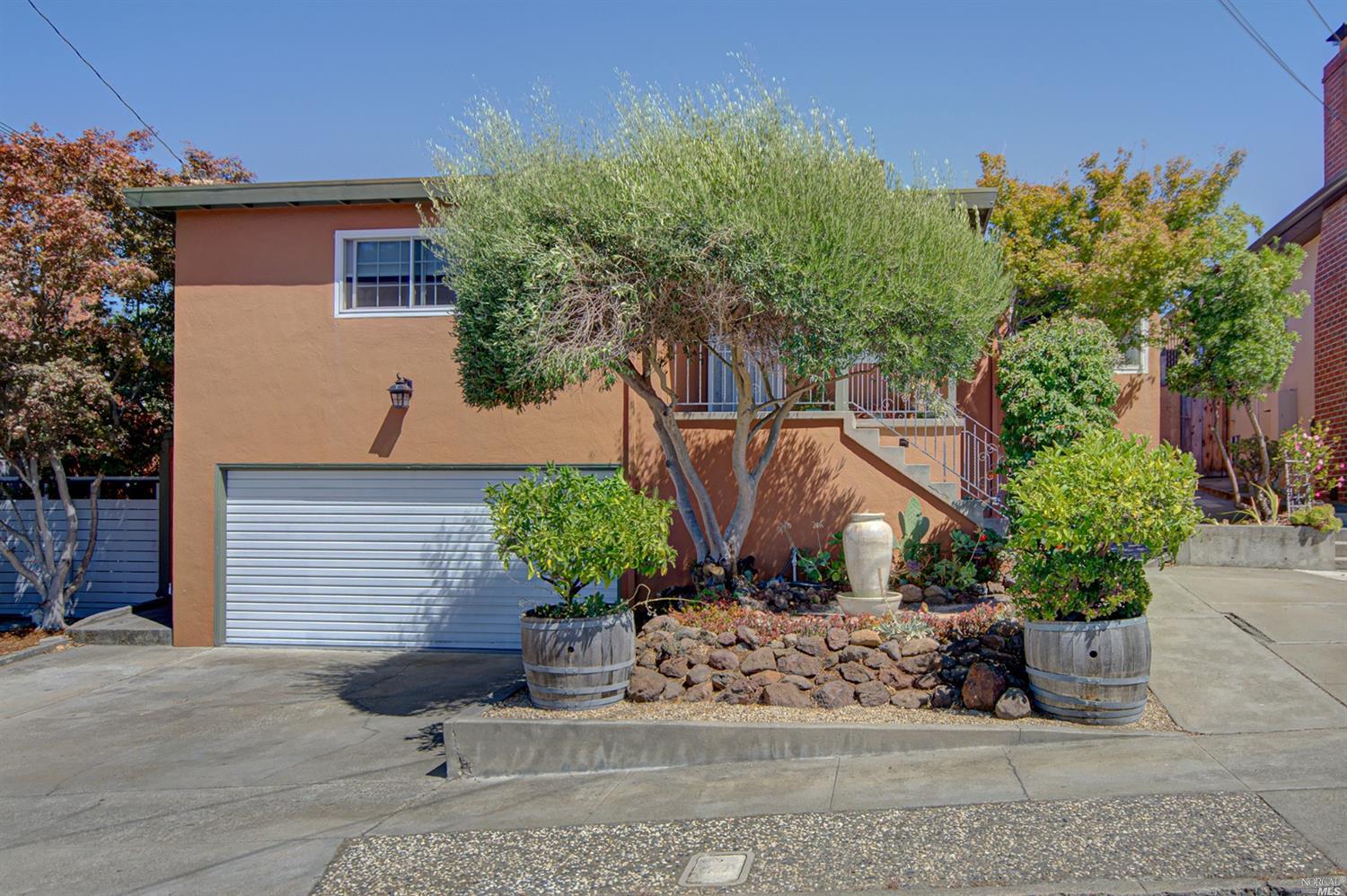 469 Vallejo Avenue Rodeo, CA 94572 - Photo 1 of 1 a view of a backyard with plants and flowers
