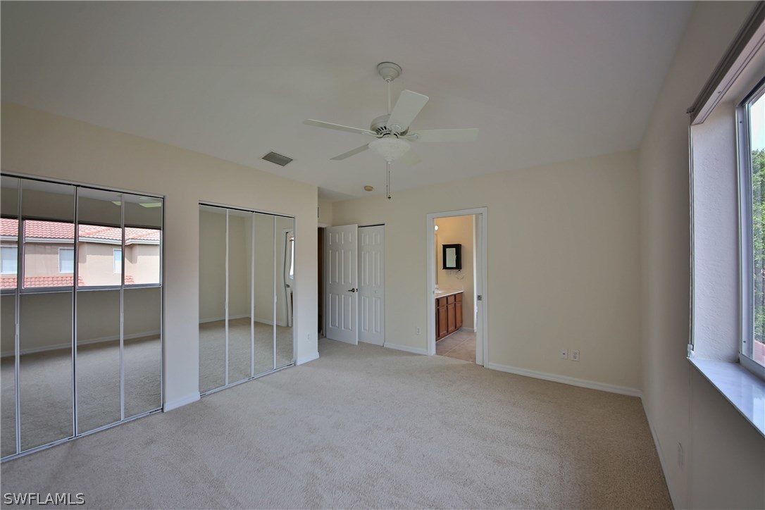 17521 Cherry Ridge Lane Fort Myers, FL 33967 - Photo 14 of 23 a view of empty room with a ceiling fan