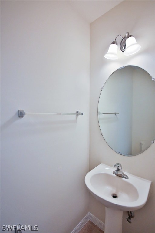17521 Cherry Ridge Lane Fort Myers, FL 33967 - Photo 20 of 23 a bathroom with a sink and mirror