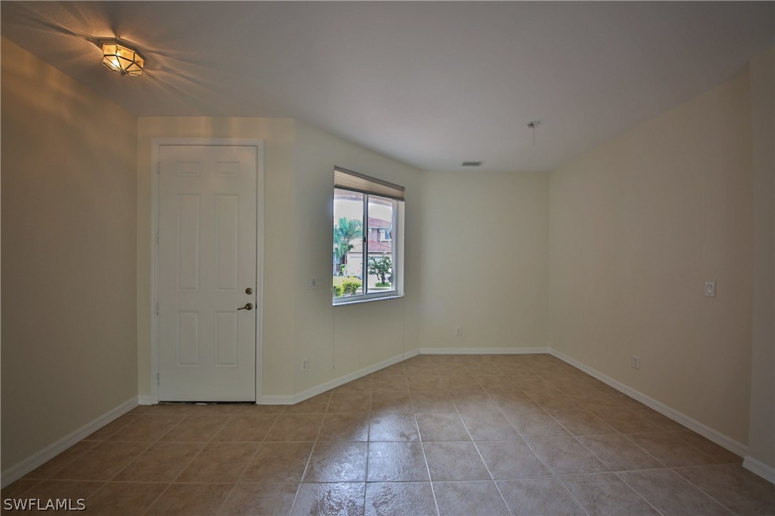 17521 Cherry Ridge Lane Fort Myers, FL 33967 - Photo 4 of 23 an empty room with a window