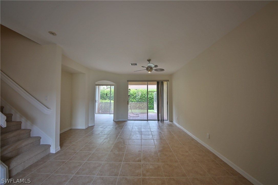 17521 Cherry Ridge Lane Fort Myers, FL 33967 - Photo 6 of 23 a view of an empty room with wooden floor and a window