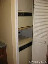 a kitchen with a stove and a refrigerator