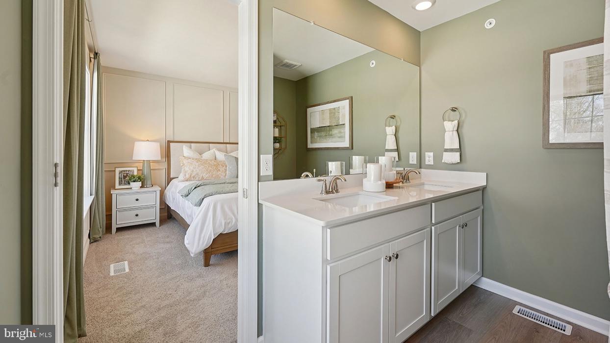 586 Swamp Creek Road Boyertown, PA 19512 - Photo 20 of 26 a en suite bathroom with a sink double vanity and a mirror