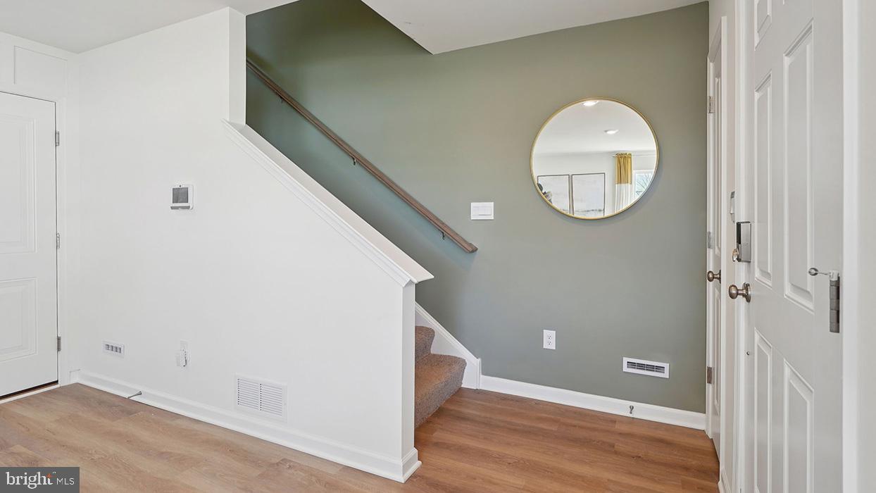 586 Swamp Creek Road Boyertown, PA 19512 - Photo 8 of 26 a view of a room with wooden floor and white doors