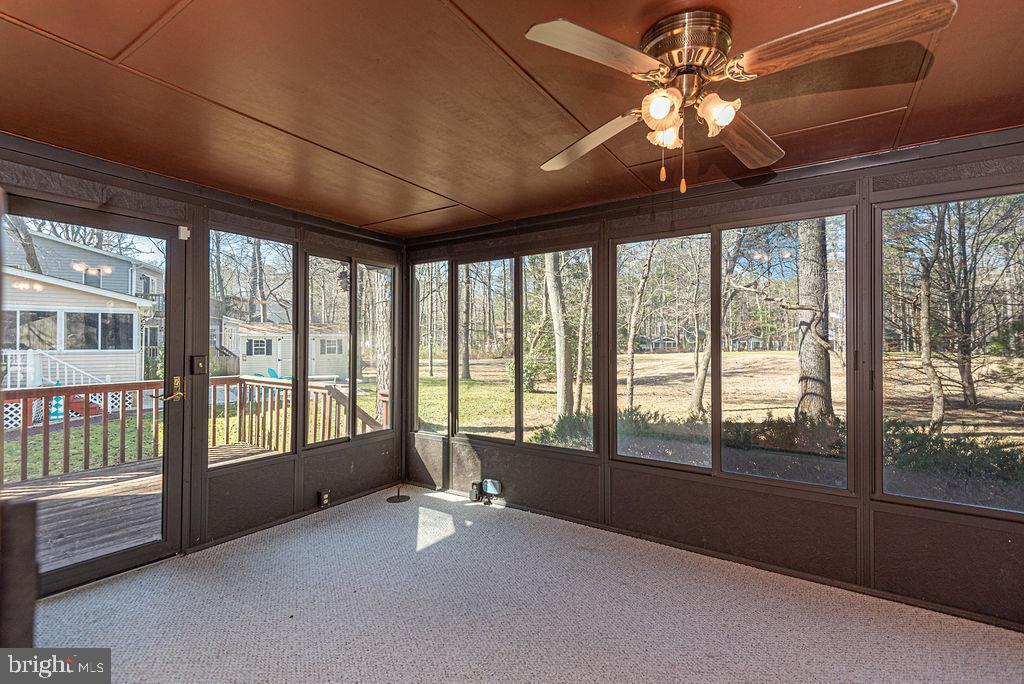 13 Drawbridge Road Ocean Pines, MD 21811 - Photo 24 of 51 step out to the deck from the 3 Season room