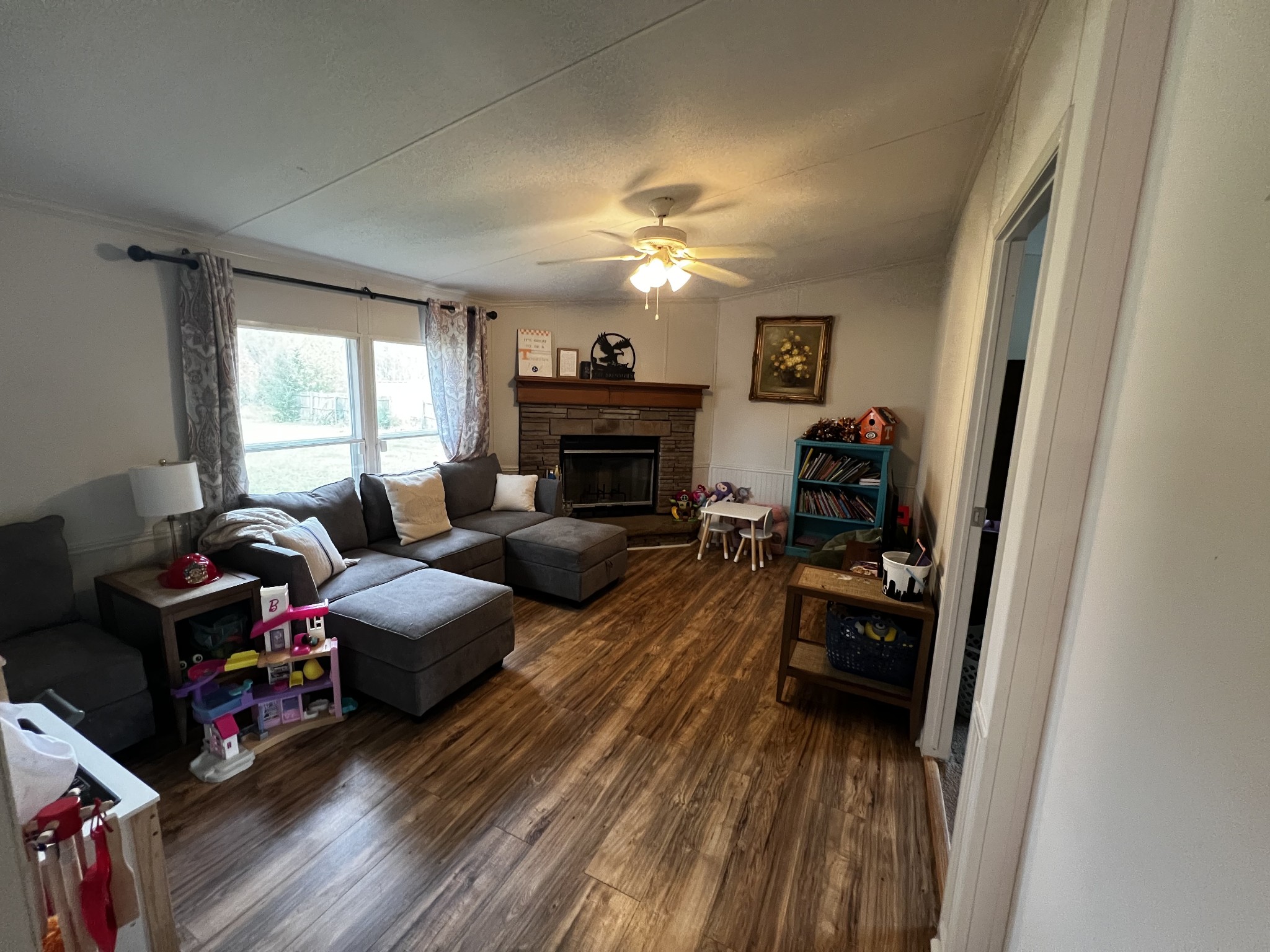 1870 Parker Road Manchester, TN 37355 - Photo 11 of 40 a living room with furniture a fireplace and a window