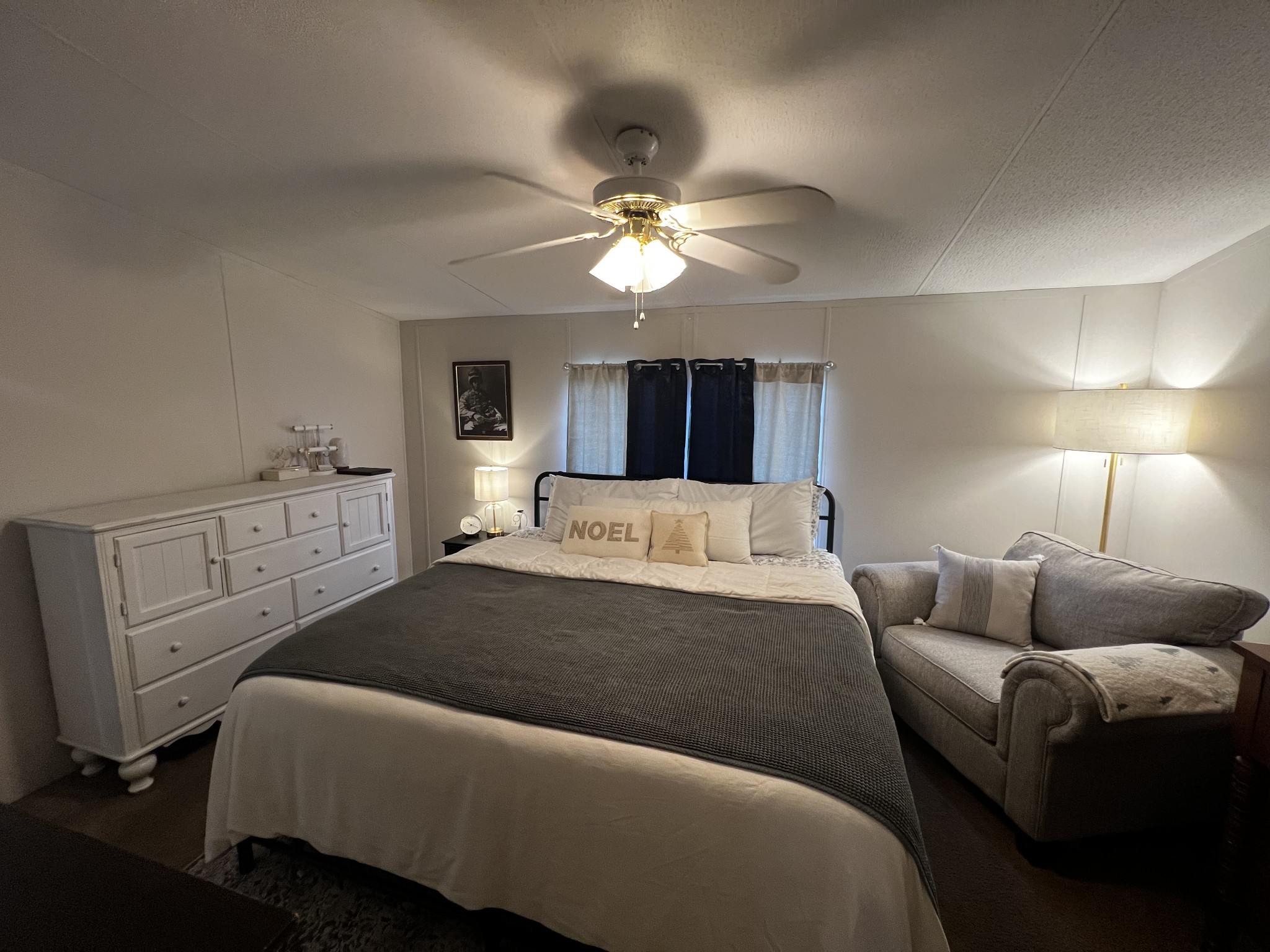 1870 Parker Road Manchester, TN 37355 - Photo 13 of 40 a bedroom with a bed and a chandelier