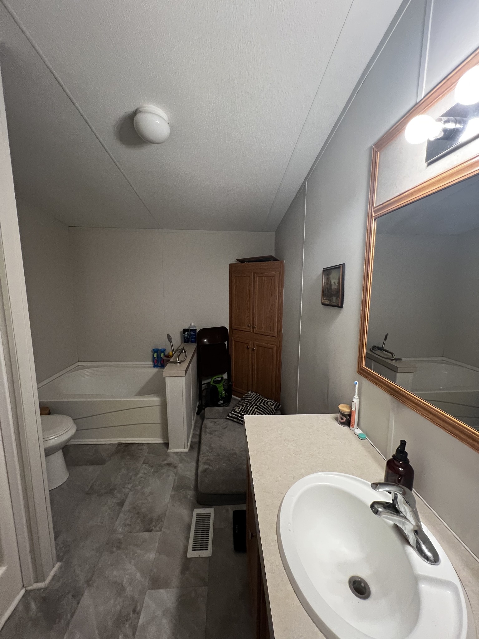 1870 Parker Road Manchester, TN 37355 - Photo 15 of 40 a bathroom with a sink and a mirror