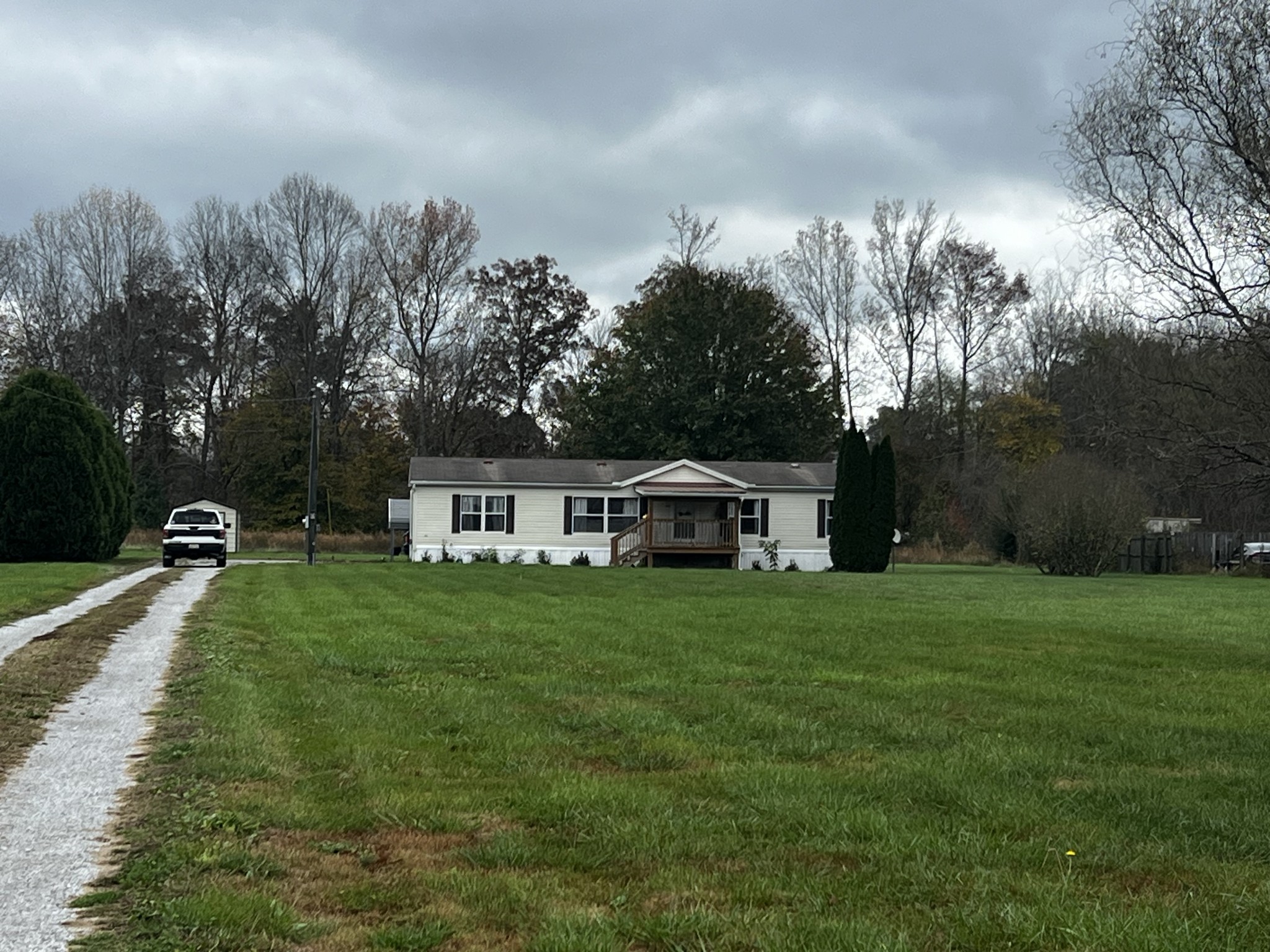 1870 Parker Road Manchester, TN 37355 - Photo 28 of 40 a front view of a house with a yard and trees