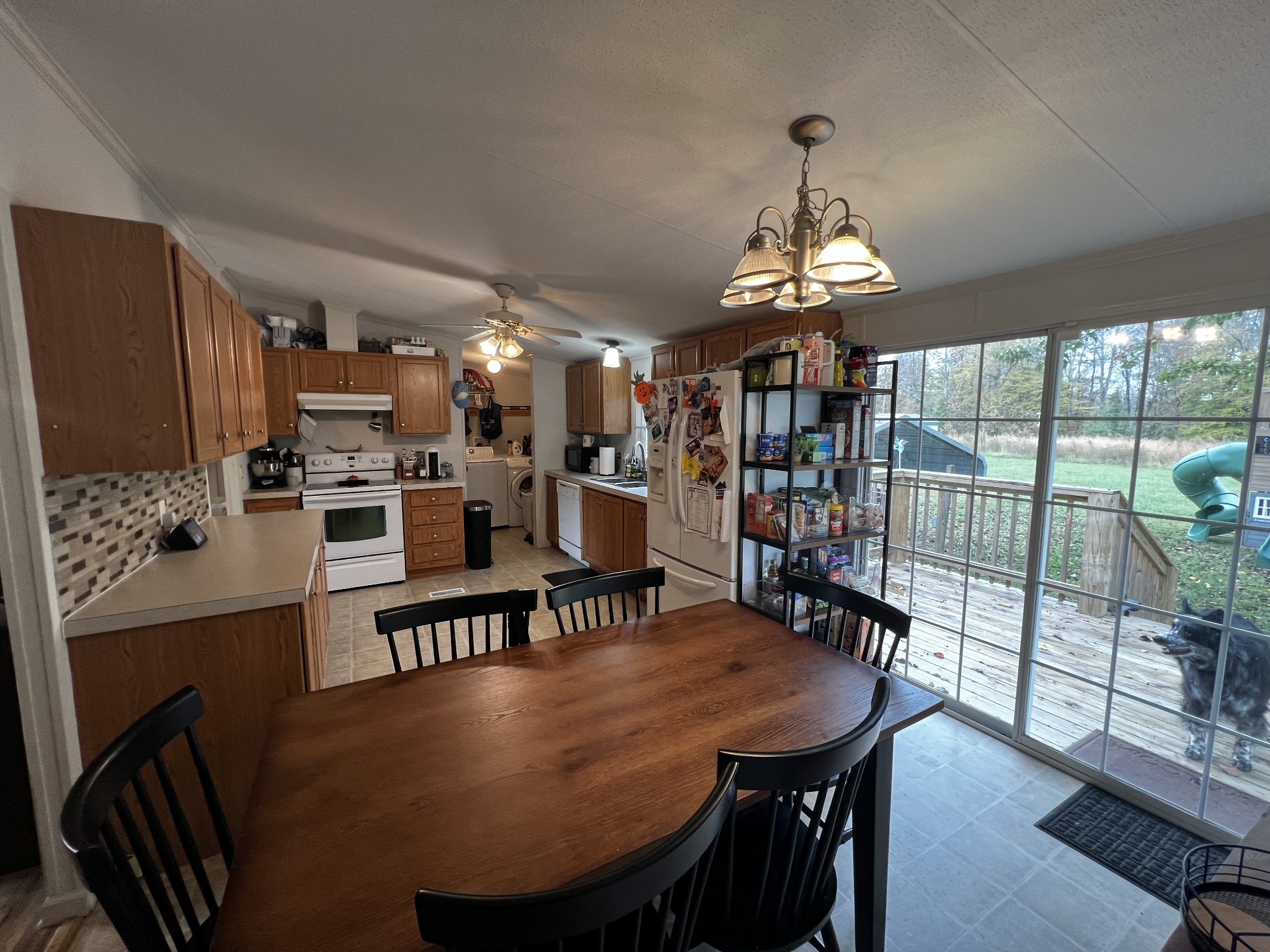 1870 Parker Road Manchester, TN 37355 - Photo 7 of 40 a dining room with furniture a chandelier and wooden floor