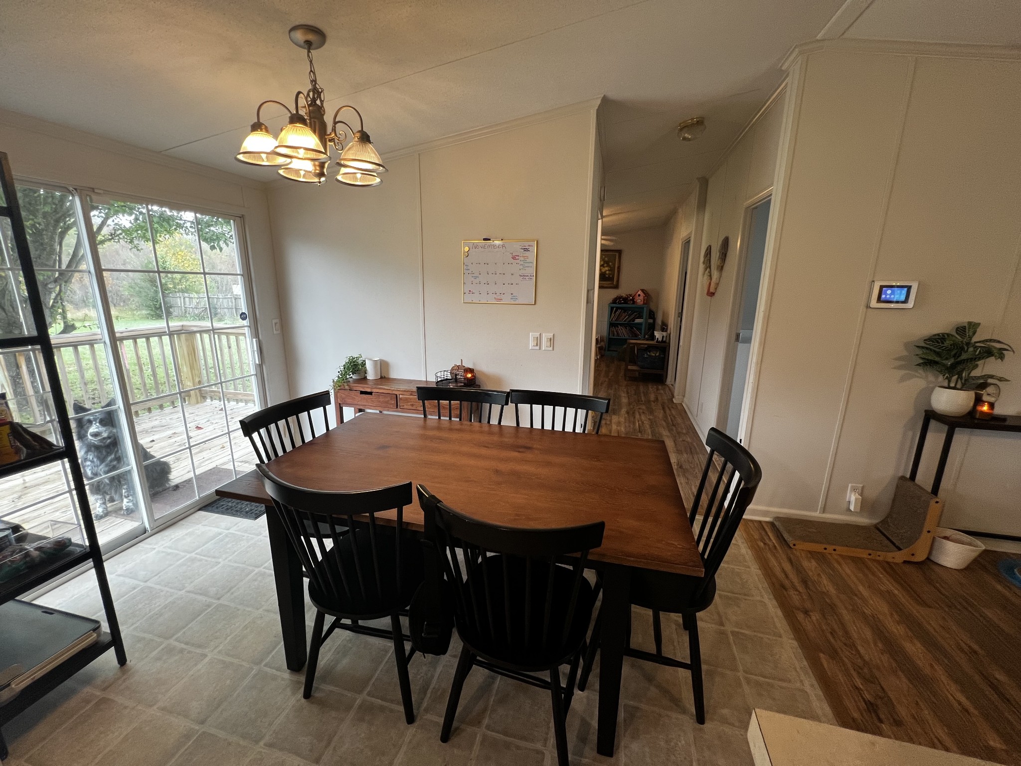 1870 Parker Road Manchester, TN 37355 - Photo 10 of 40 a dining room with furniture a chandelier and wooden floor