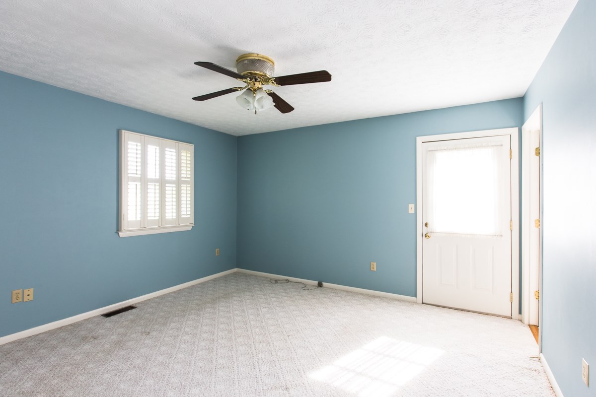 868 Todd Road Mount Sidney, VA 24467 - Photo 11 of 47 a view of a big room with a ceiling fan and a window
