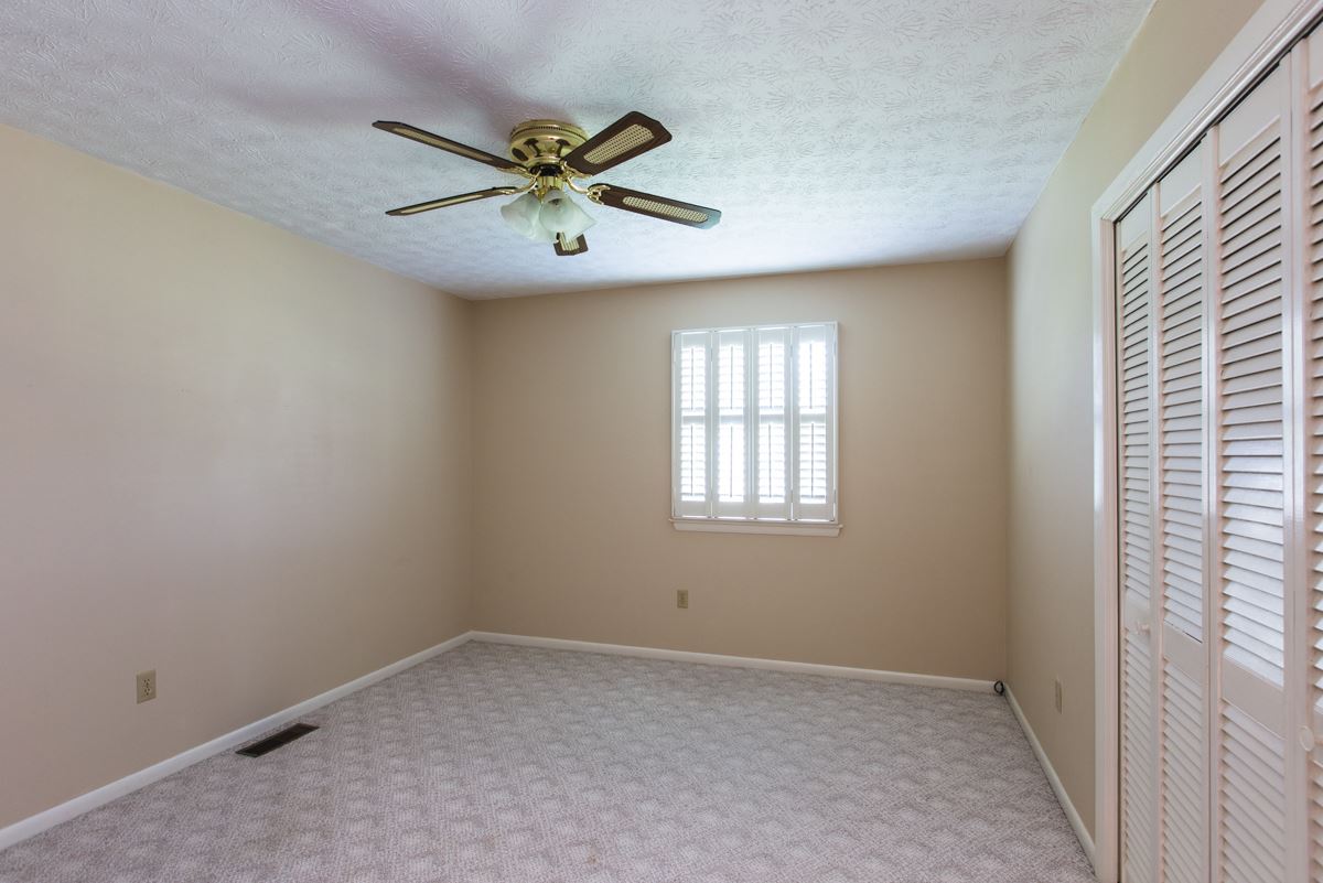 868 Todd Road Mount Sidney, VA 24467 - Photo 13 of 47 an empty room with windows and fan