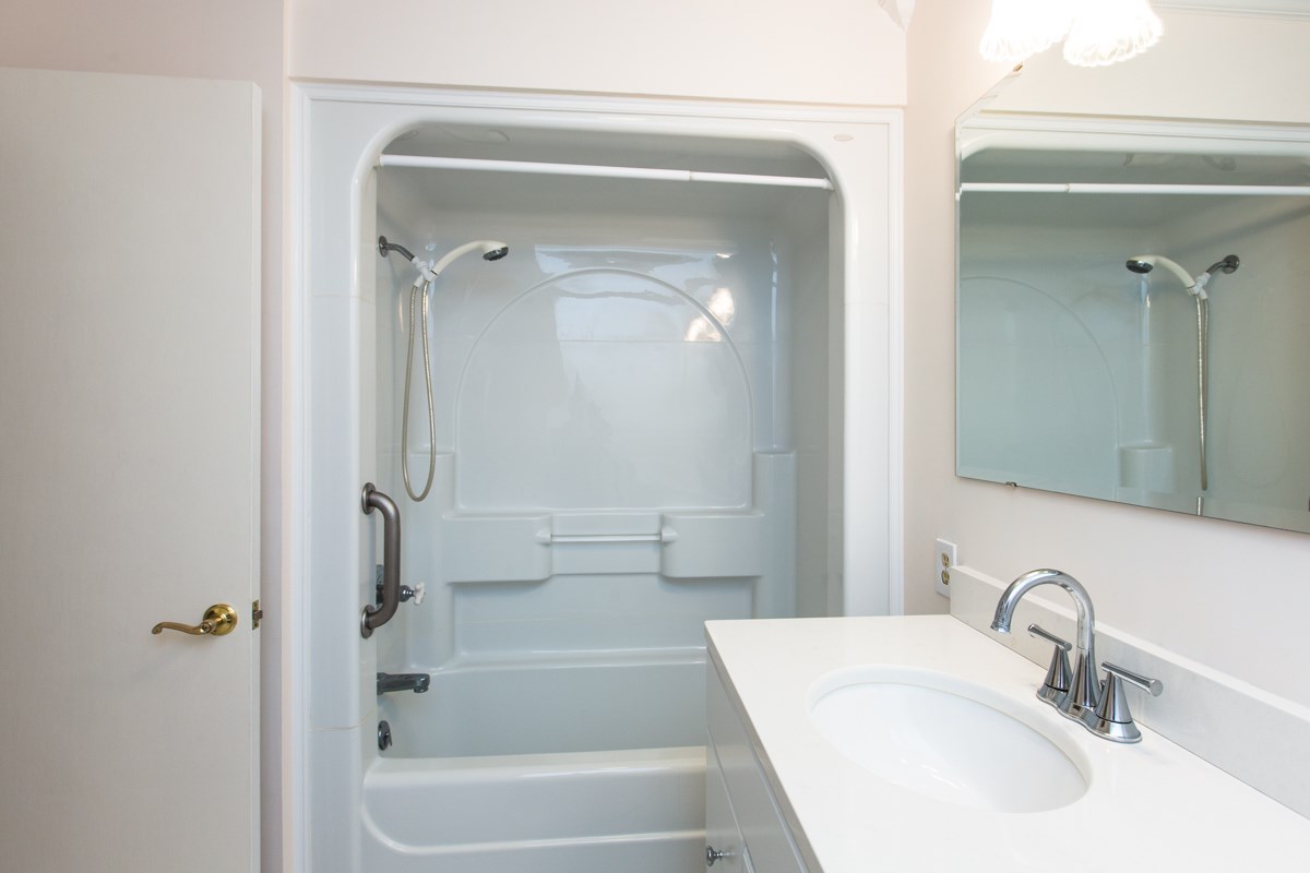 868 Todd Road Mount Sidney, VA 24467 - Photo 15 of 47 a bathroom with a tub sink and mirror